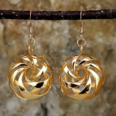 Gold-plated brass earrings shaped like diagonally-banded tori